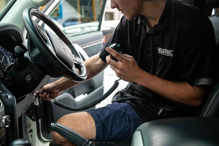 Voltaic technician performing a UHF radio installation in Perth