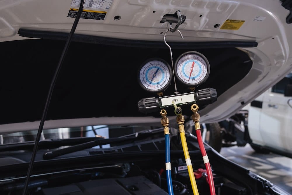 Close up of a regassing as part of a car aircon service in Perth