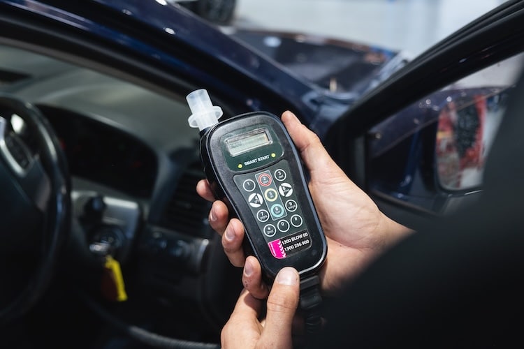 Device during an alcohol interlock installation showing where you test your blood alcohol