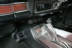 Interior of a car AC installation in Perth showing the vintage AC dials