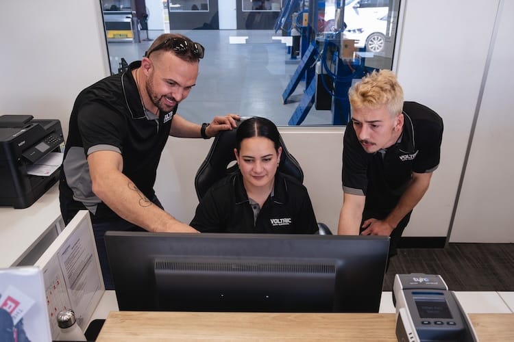 Administration team looking at the computer