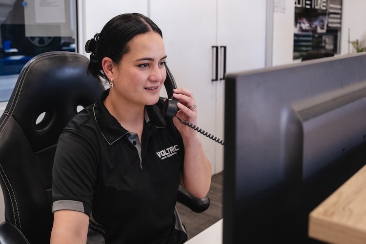 Tara working the phone at reception