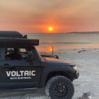 4wd on beach with voltaic logo